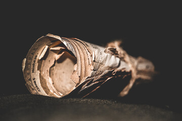 old rolls of paper that are yellowed, old paper that is worn out, sheets of old or worn paper, old...