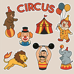 A colorful set of circus-themed stickers featuring clowns, a bear on a ball, a lion with a flaming tail, an elephant, a juggler with balloons, a circus tent, and a strongman lifting weights. 