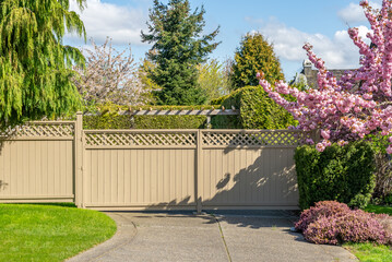 Fence built from wood in Vancouver, Canada, North America. Outdoor landscape. Security and privacy...