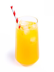Orange juice with ice and red striped straw in drinking glass
