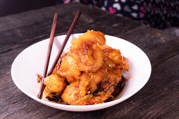 Sweet and sour chicken. Fried meat. Food concept. Chopsticks