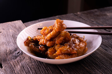 Sweet and sour chicken. Fried meat. Food concept. Chopsticks