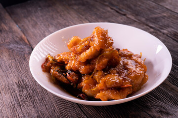 Sweet and sour chicken. Fried meat. Food concept. Chopsticks
