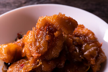 Sweet and sour chicken. Fried meat. Food concept. Chopsticks