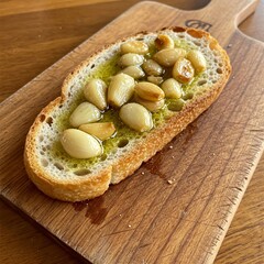 Garlic Confit Roasted in Olive Oil Spread on Toasted French Bread