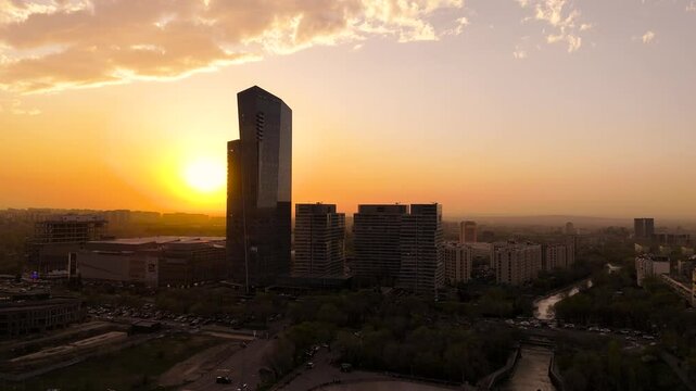 View of the tallest building in Almaty at sunset