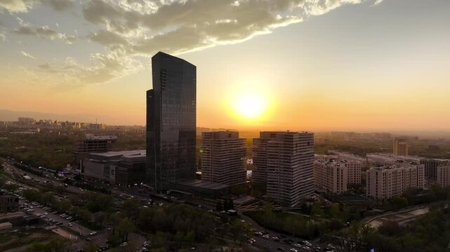 View of the tallest building in Almaty at sunset