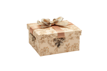 Transparent background of a decorative gift box with a golden floral pattern and a satin ribbon bow.
