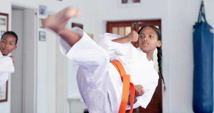 Girls, karate or class with fighting technique for self defense training, taekwondo or martial arts. Teenager, learning or practice session with kicking or punching for sport or lesson in aikido dojo