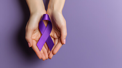 World Alzheimer's day. September 21. International Epilepsy Day. Adult hands holding purple ribbon on purple background. World Lupus Day and world cancer,