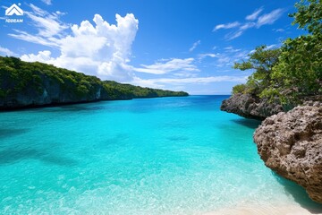 A stunning tropical beach scene featuring turquoise waters, lush greenery, and dramatic cliffs under a bright blue sky.
