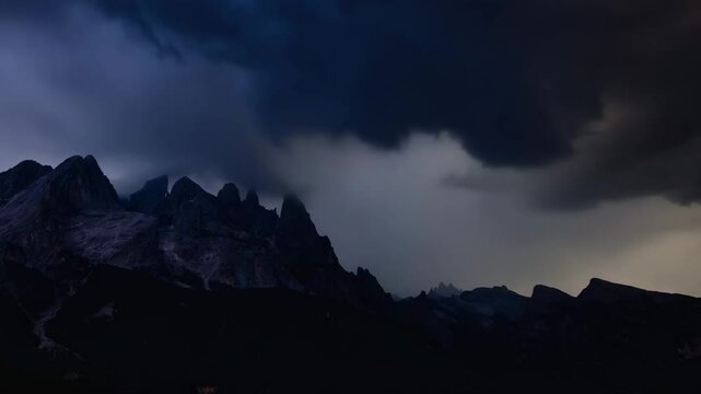 A lightning bolt striking behind distant mountains.

