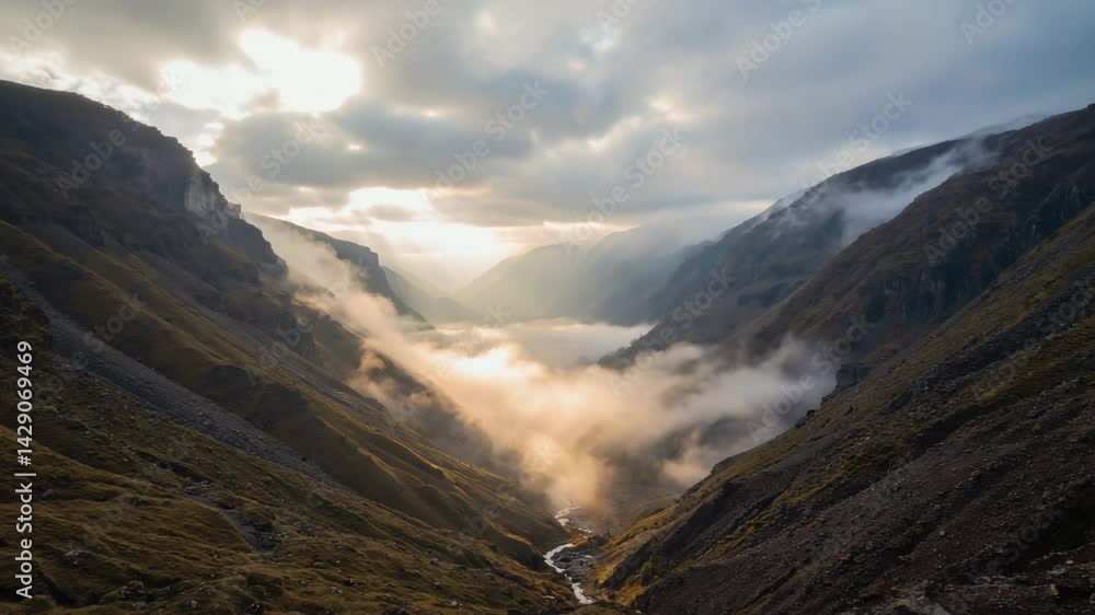 Poster fog rolling across a valley with sunbeams breaking through.