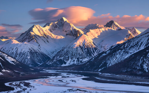 Snowy Mountain Peaks And Valley At Sunrise With Pink Clouds Beautiful Alpine Landscape Tranquil Winter Scenery Majestic Mountain Range Frozen River And Wilderness Area