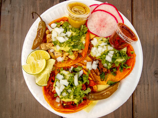 beef Birria Tacos are perfect served with onion, cilantro and a squeeze of fresh lime juice with a bowl of consommé on the side for dipping!
