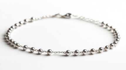 Fototapeta premium Ultra-minimal dot bracelet in white gold, isolated on white background