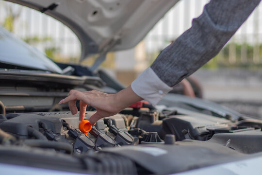 mechanic changing car engine