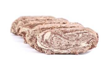 Sliced cocoa Halva on white background. It is a typical sweet of  Greek and Middle Eastern cuisine