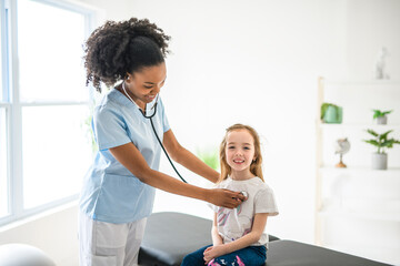 Doctor at working with child girl patient in a rehab clinic