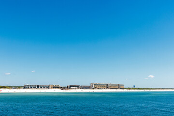 A distant view, looking back at Gulf State Park from its fishing pier along the Gulf Coast, with...
