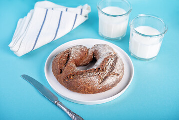 Rye bread in a plate on a blue background