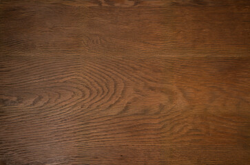 Dark brown wooden surface texture with natural wood grain pattern