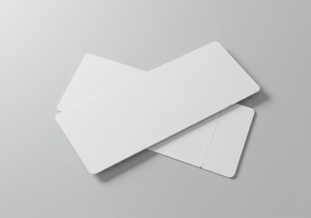 Minimal composition of two blank white tickets on a light grey background with soft shadows