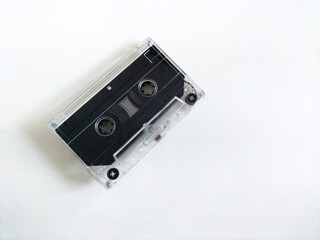 Obraz premium Clear plastic audio cassette on white background