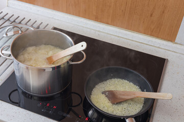Boiled cabbage and fried onion in a pan