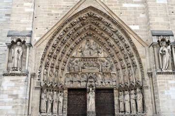 Obraz premium Entrance of cathedral Notre Dame,architectural details, Paris, France