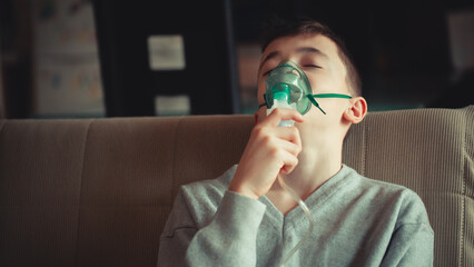 Young Boy Managing Asthma with Inhaler and Oxygen Support