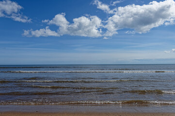 Looking at lines of small waves rolling onto the Beach from Carnoustie Bay in the April sunshine of...