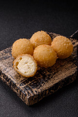 Cheese fried balls or croquettes with potatoes or rice