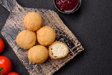 Cheese fried balls or croquettes with potatoes or rice