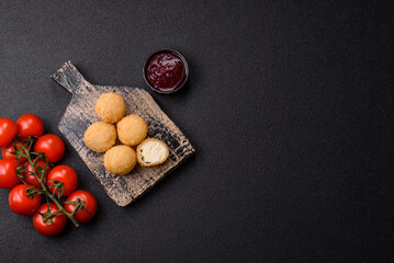 Cheese fried balls or croquettes with potatoes or rice