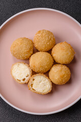 Cheese fried balls or croquettes with potatoes or rice