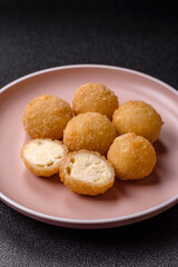 Cheese fried balls or croquettes with potatoes or rice
