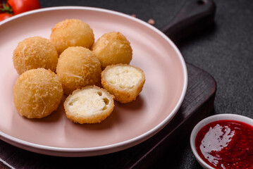 Cheese fried balls or croquettes with potatoes or rice