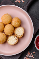 Cheese fried balls or croquettes with potatoes or rice