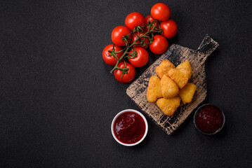 Fried mozzarella or brie cheese with cranberry or raspberry sauce