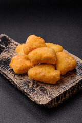 Fried mozzarella or brie cheese with cranberry or raspberry sauce