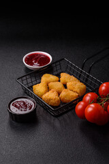 Fried mozzarella or brie cheese with cranberry or raspberry sauce