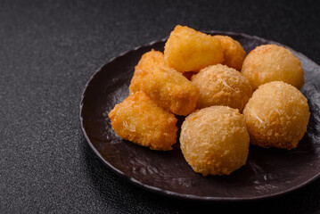 Fried mozzarella or brie cheese with cranberry or raspberry sauce