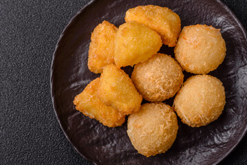 Fried mozzarella or brie cheese with cranberry or raspberry sauce