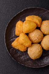 Fried mozzarella or brie cheese with cranberry or raspberry sauce