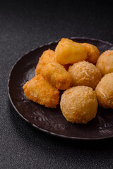Fried mozzarella or brie cheese with cranberry or raspberry sauce