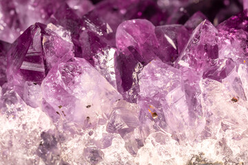 Amethyst purple crystals. Gems. Mineral crystals in the natural environment. Texture of precious...
