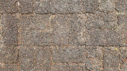 A dirt path paved with large stones, the stone courtyard of an ancient castle in Thailand, the floor of a castle in the past. Texture Image.