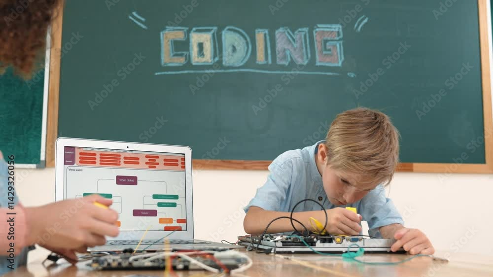 Aufkleber caucasian smart boy fixing main board by using screwdriver at stem technology lesson while smiling s