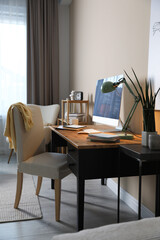 Comfortable workplace with modern computer in home office